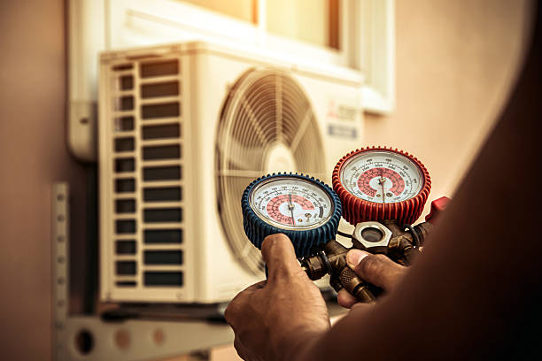 Professional Heat Pump Repair technician working in Durham, NH
